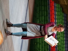 Sam Reid reading to children