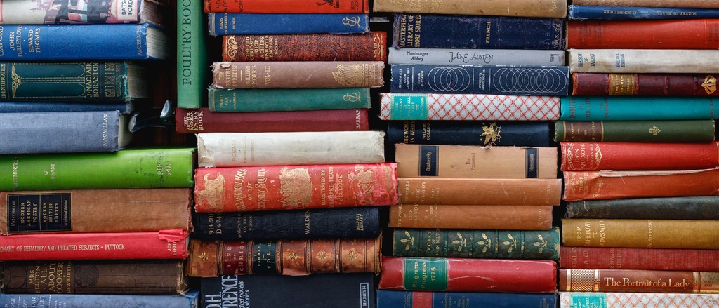 Multi-colored books stacked