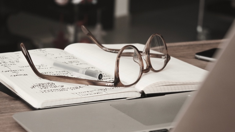 glasses on a book
